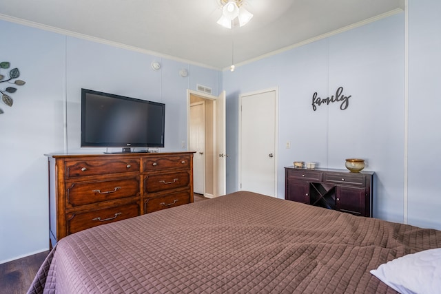 bedroom with ornamental molding and ceiling fan