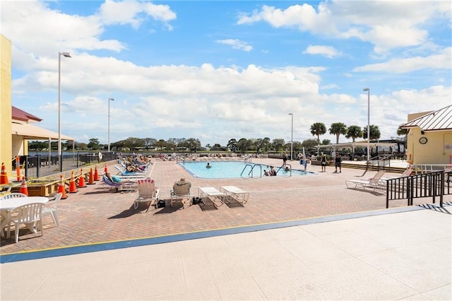 view of swimming pool with a patio