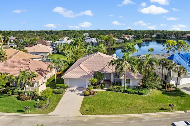 birds eye view of property with a water view