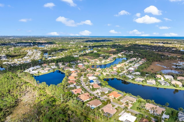 aerial view featuring a water view and a residential view