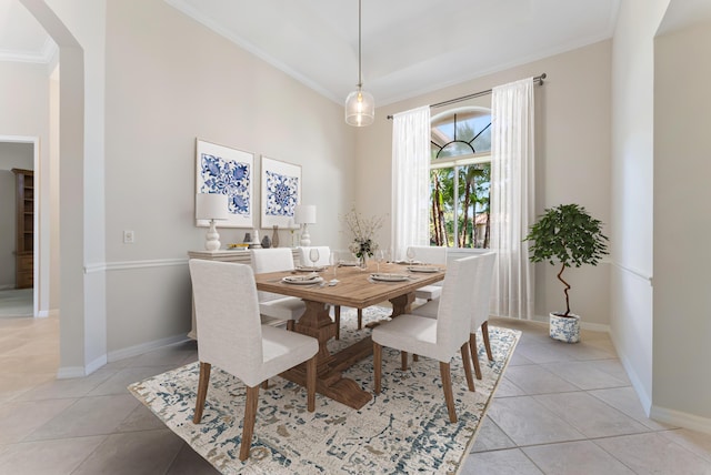 8037 SE Woodlake Ln, Hobe Sound, FL 33455 - dining space with arched walkways, light tile patterned floors, baseboards, and ornamental molding