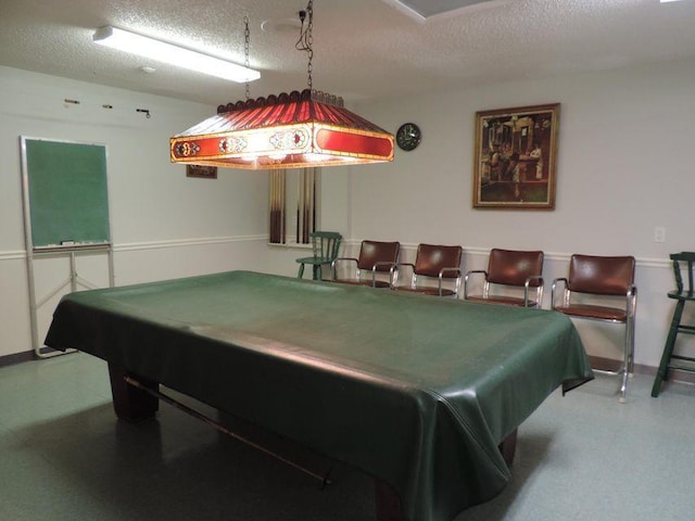 playroom featuring a textured ceiling and billiards