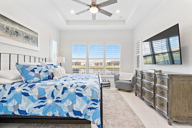 bedroom with a raised ceiling, a ceiling fan, and recessed lighting