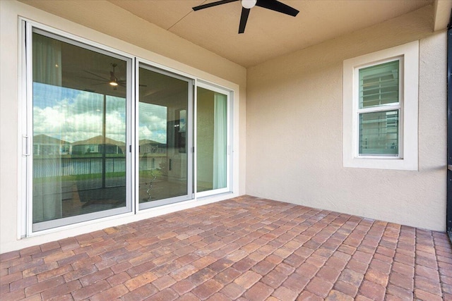 view of patio featuring ceiling fan