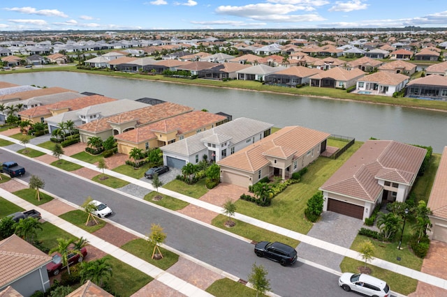 aerial view with a water view and a residential view