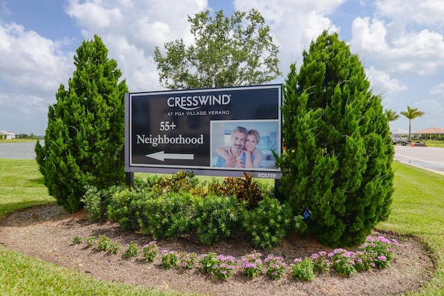 community sign with a lawn