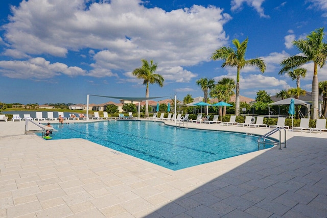 community pool with a patio area