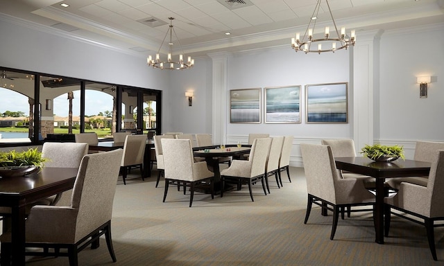 dining space with a chandelier, crown molding, carpet, and a tray ceiling