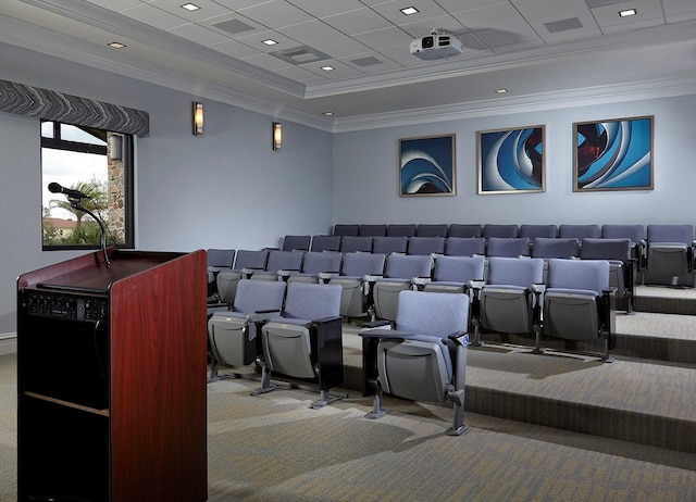home theater with crown molding, carpet flooring, a drop ceiling, and a tray ceiling