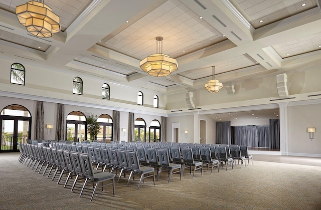 interior space with a towering ceiling, coffered ceiling, and carpet floors