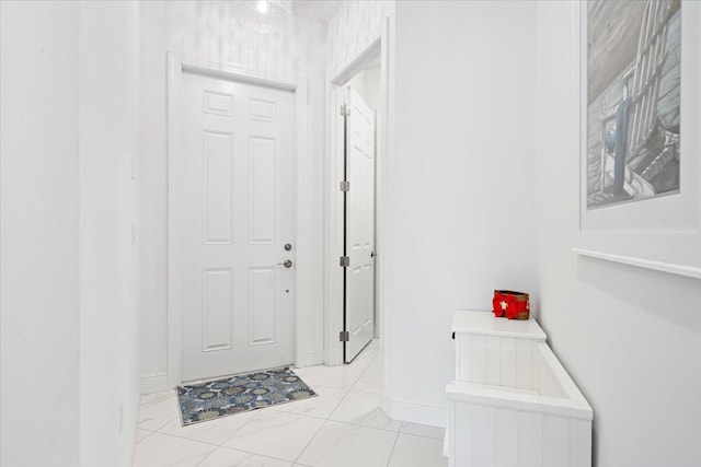 interior space with marble finish floor and baseboards