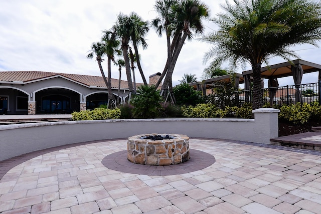 view of patio / terrace featuring a gazebo and a fire pit