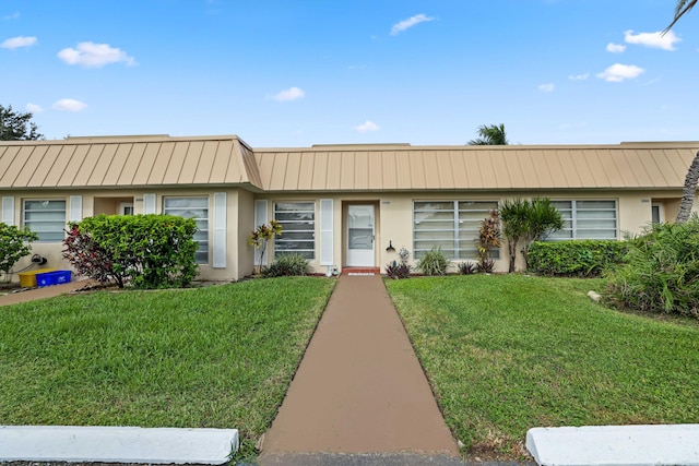 ranch-style house with a front yard