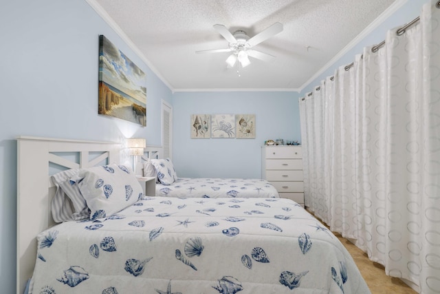 bedroom featuring a textured ceiling, ceiling fan, and crown molding