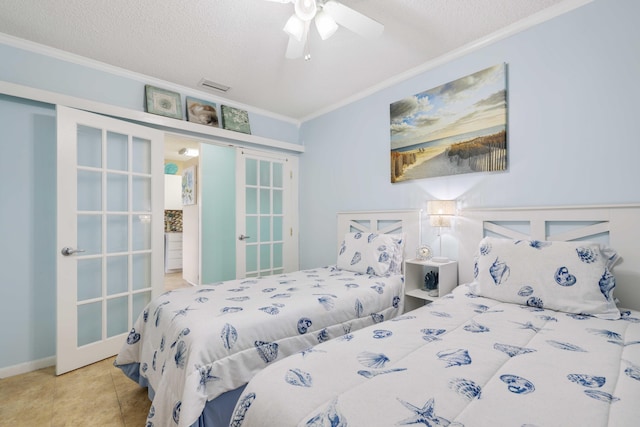 bedroom featuring tile patterned floors, crown molding, ceiling fan, and a textured ceiling