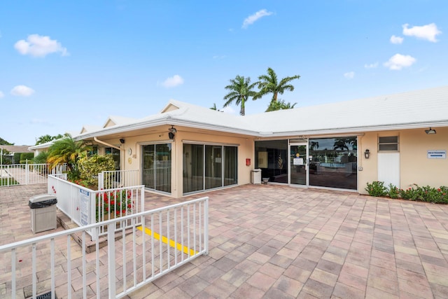 back of property featuring a patio