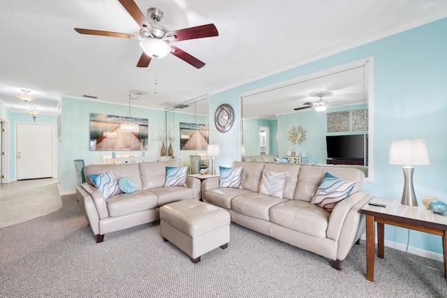 living room with carpet flooring, ceiling fan, and crown molding