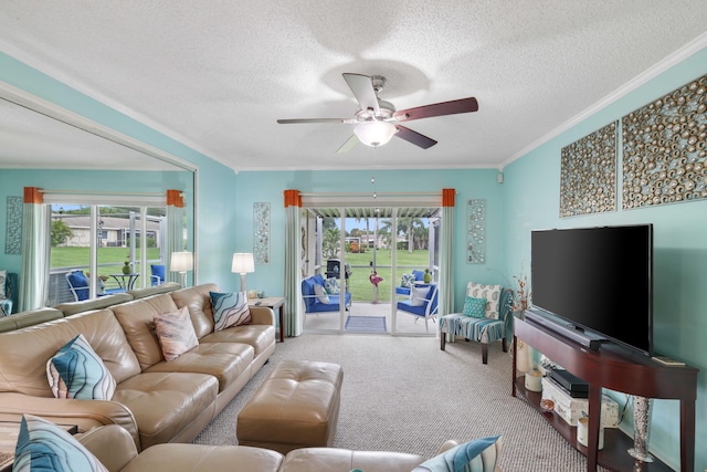 carpeted living room featuring a textured ceiling, ceiling fan, and crown molding