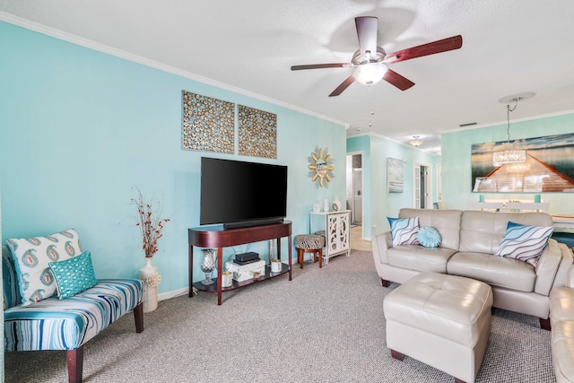 carpeted living room with ceiling fan and ornamental molding