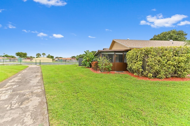 view of yard with a sunroom