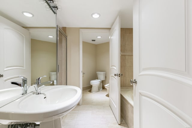 bathroom featuring toilet, tile patterned flooring, a bidet, sink, and walk in shower