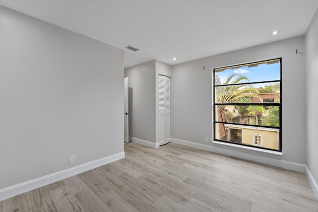 spare room with light hardwood / wood-style floors