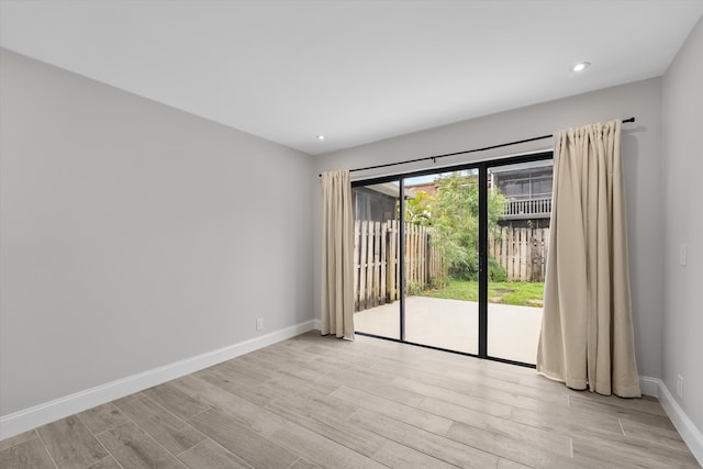 spare room featuring light hardwood / wood-style flooring