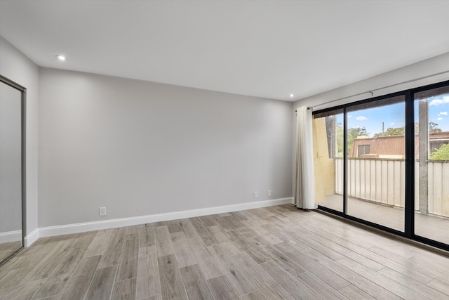 unfurnished room featuring light hardwood / wood-style floors