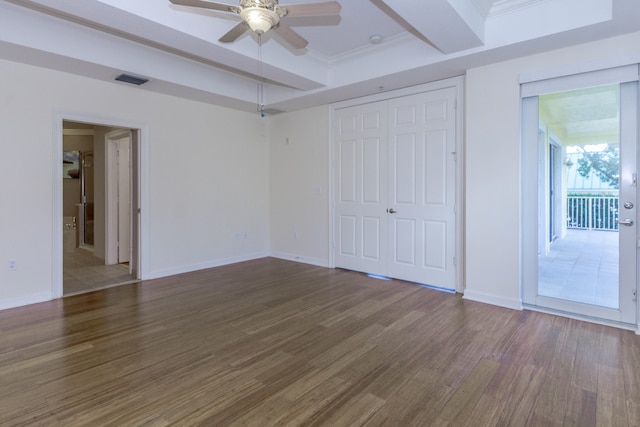 unfurnished bedroom featuring dark wood-type flooring, crown molding, ceiling fan, and beam ceiling