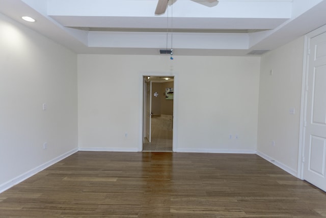 unfurnished room with dark hardwood / wood-style floors and ceiling fan