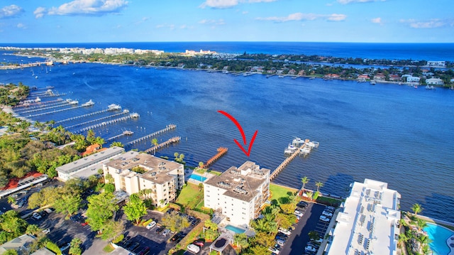 birds eye view of property with a water view