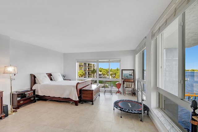 tiled bedroom with a water view