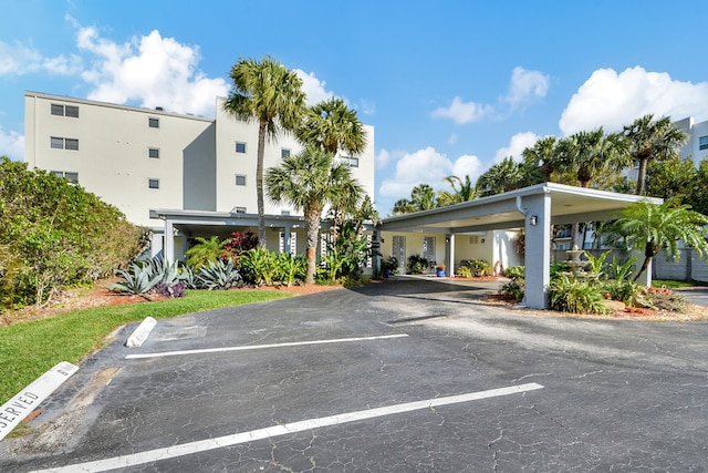 view of vehicle parking featuring a carport