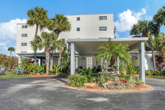 view of building exterior with a carport