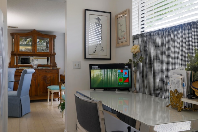 office with light hardwood / wood-style floors