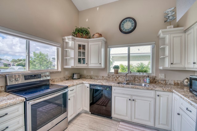 kitchen with white cabinets, stainless steel electric range, black dishwasher, vaulted ceiling, and sink