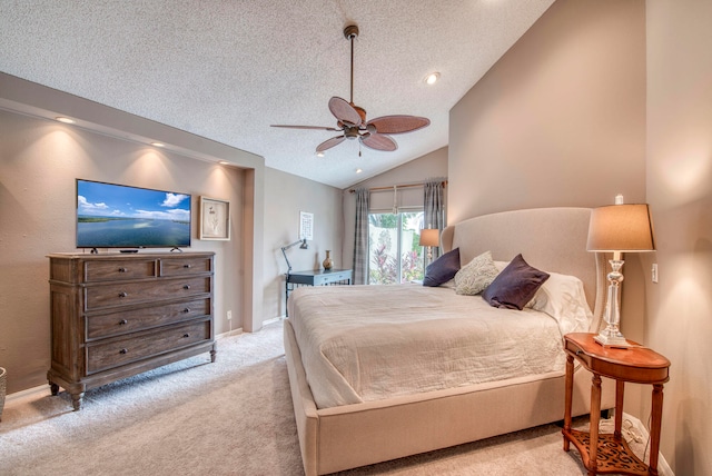 bedroom featuring ceiling fan, a textured ceiling, vaulted ceiling, and light colored carpet