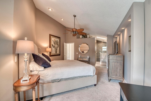 carpeted bedroom featuring a textured ceiling, vaulted ceiling, and ceiling fan