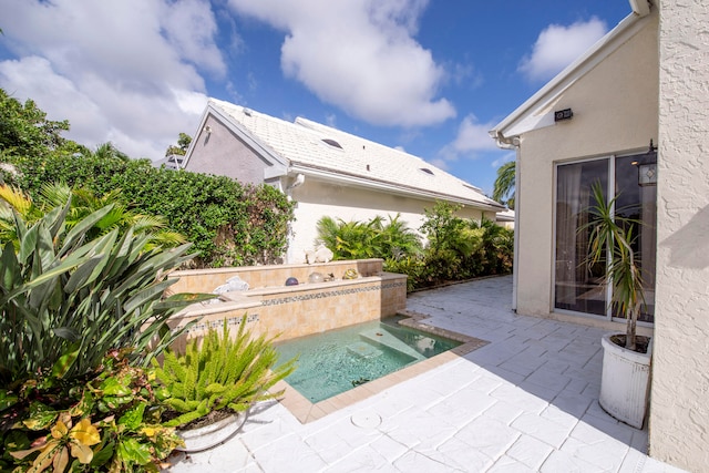 view of patio / terrace featuring a jacuzzi