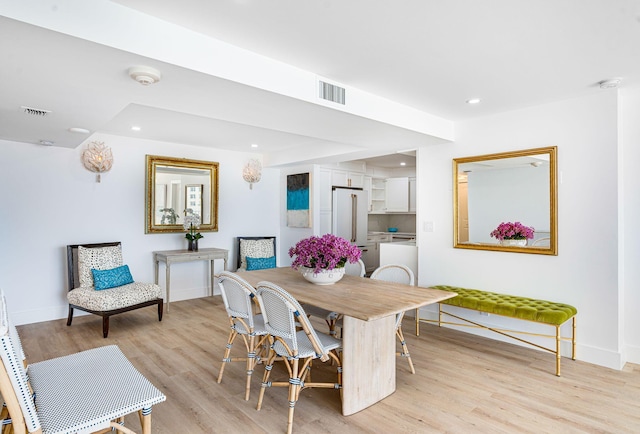 dining area with light hardwood / wood-style floors