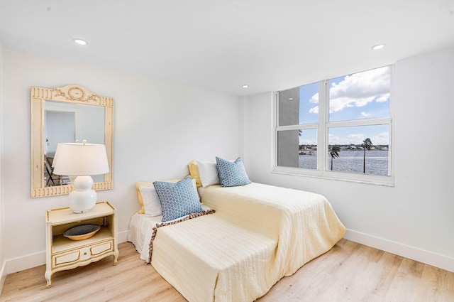 bedroom with hardwood / wood-style flooring