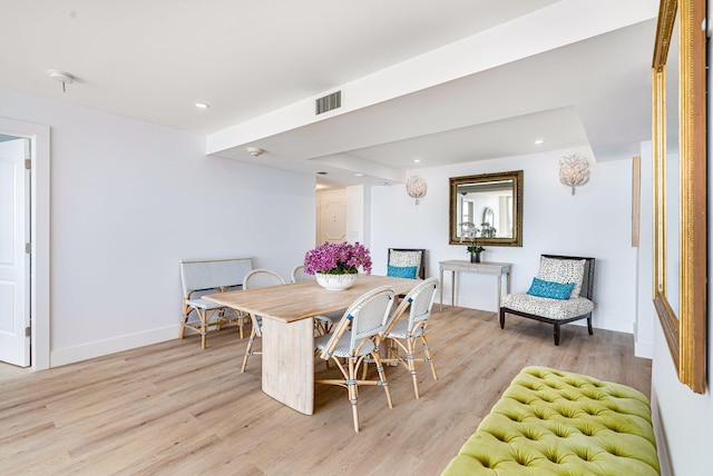 dining space with light hardwood / wood-style flooring