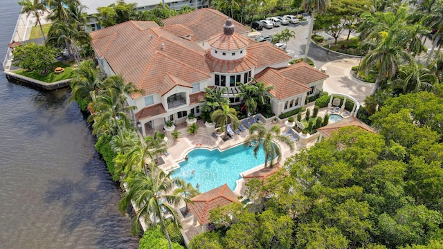 birds eye view of property with a water view