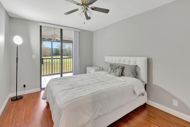 bedroom featuring access to outside, wood-type flooring, and ceiling fan