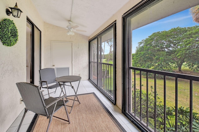 sunroom with vaulted ceiling and ceiling fan