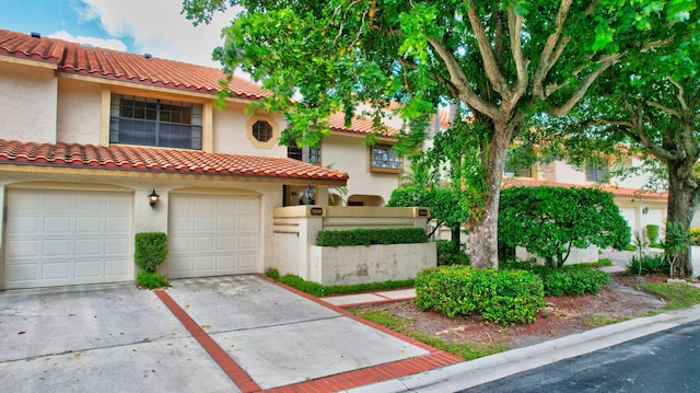 view of front of home with a garage