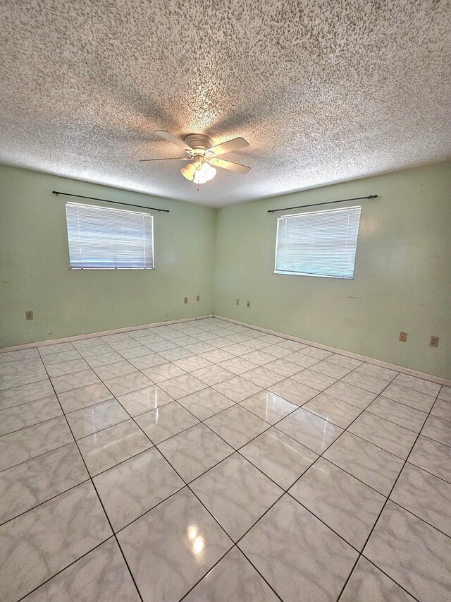 275 SE 16th Ave, Okeechobee, FL 34974 - empty room with plenty of natural light, ceiling fan, and a textured ceiling
