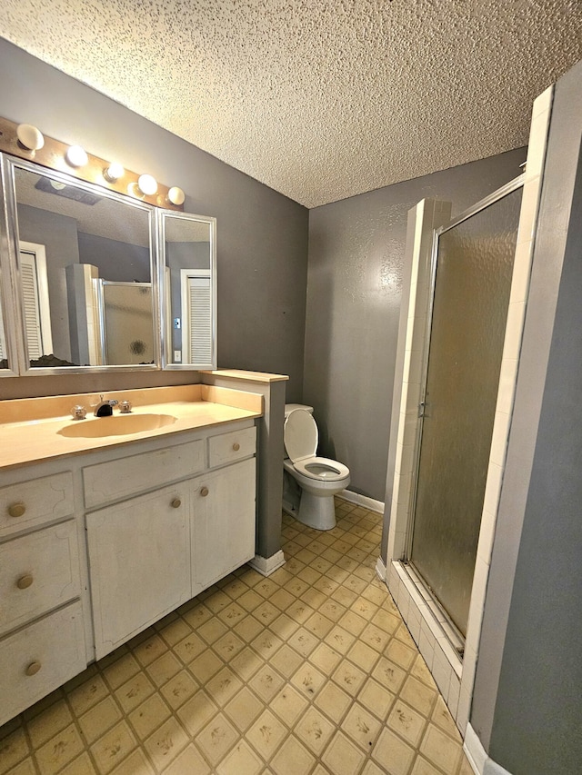 275 SE 16th Ave, Okeechobee, FL 34974 - bathroom with a shower stall, a textured ceiling, toilet, and vanity