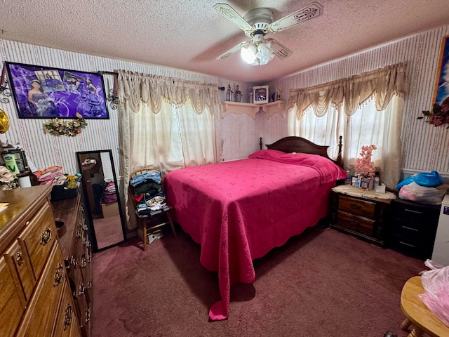 carpeted bedroom with a textured ceiling, multiple windows, and ceiling fan