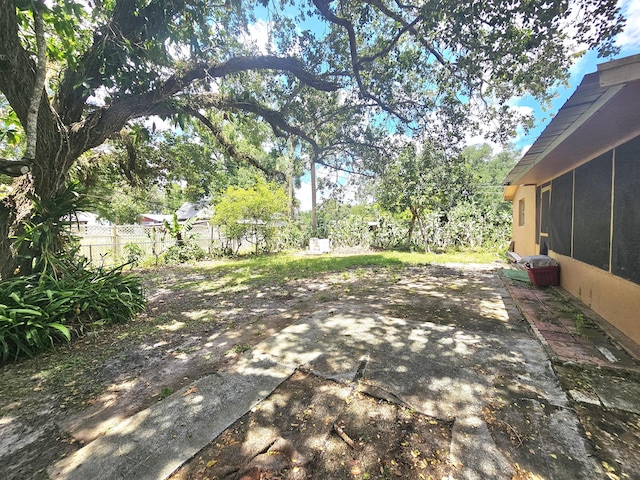 275 SE 16th Ave, Okeechobee, FL 34974 - view of patio / terrace with fence and a sunroom